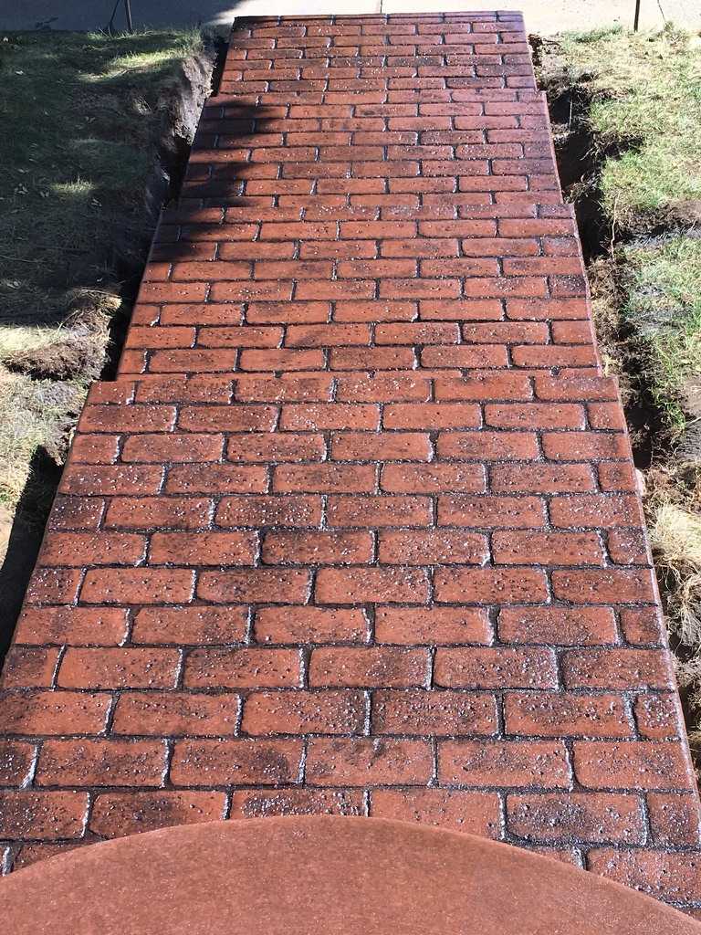 Custom brick stamp and colored sidewalk and patio