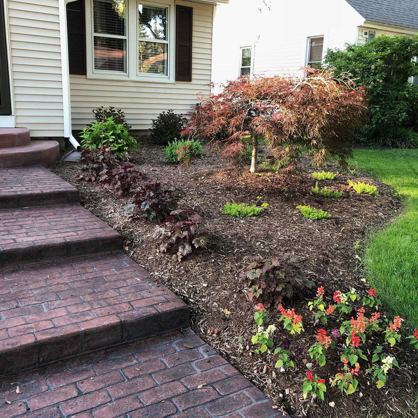 Custom brick stamp and colored sidewalk and patio