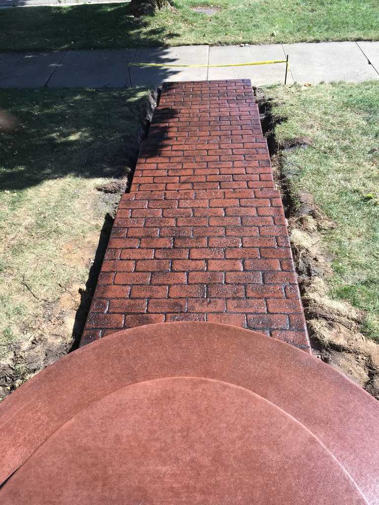 Custom brick stamp and colored sidewalk and patio